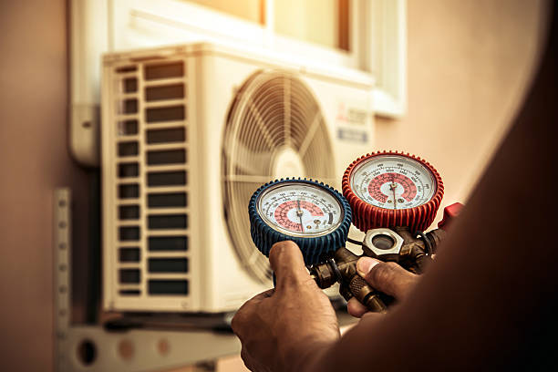 Professional Heat Pump Repair technician working in Arlington, TX